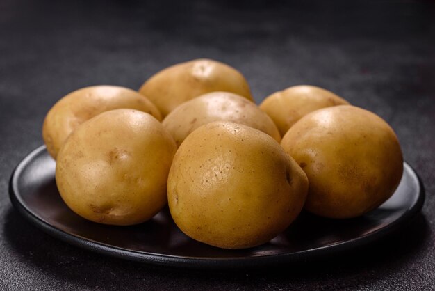 A pile of young potatoes on the table The benefits of vegetables