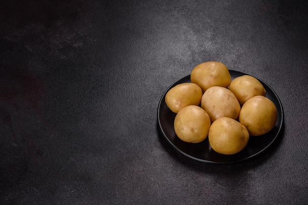 A pile of young potatoes on the table The benefits of vegetables