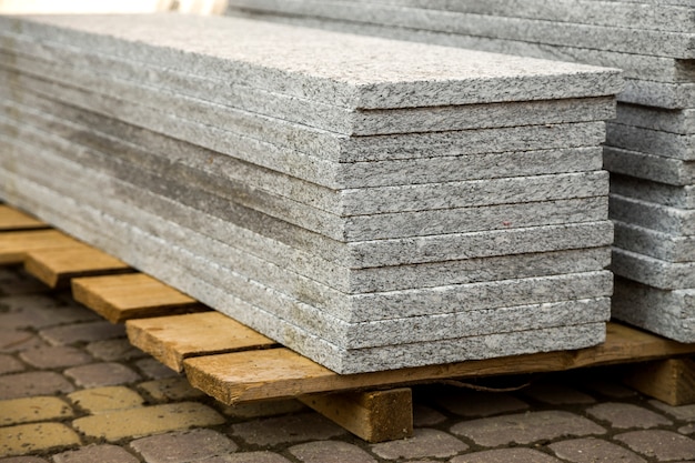 Piles of granite marble slabs.  Stone sheets for decorative construction.