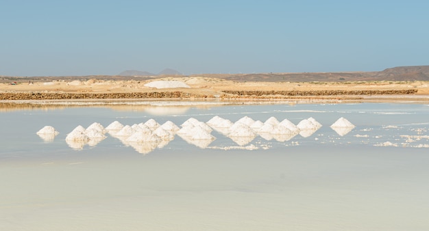 piles of salt on salt mining plain on Cape Verde