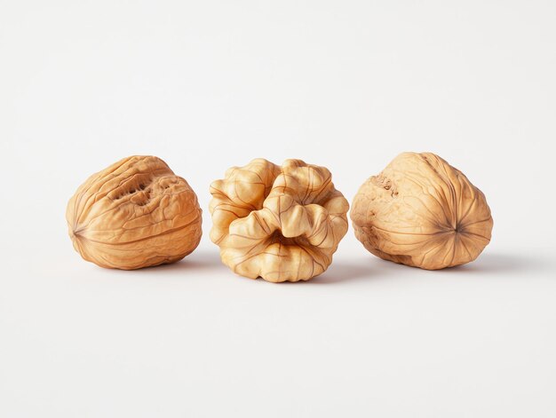 Photo piles of whole and shelled walnuts on white background natural and detailed