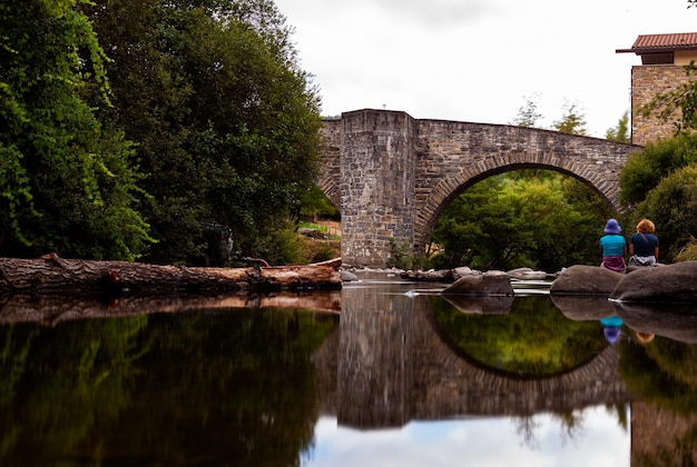 Pilgrim's way to Santiago Zubiri medieval bridge called Puente de la Rabia Navarra