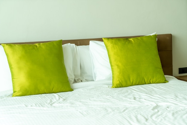 Pillows on bed in bedroom interior