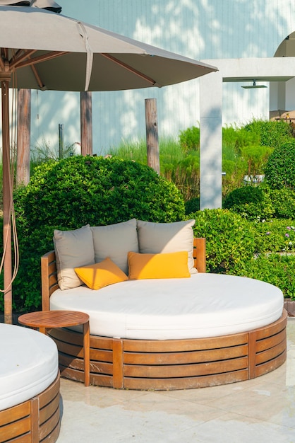 Pillows on outdoor patio chair with umbrella