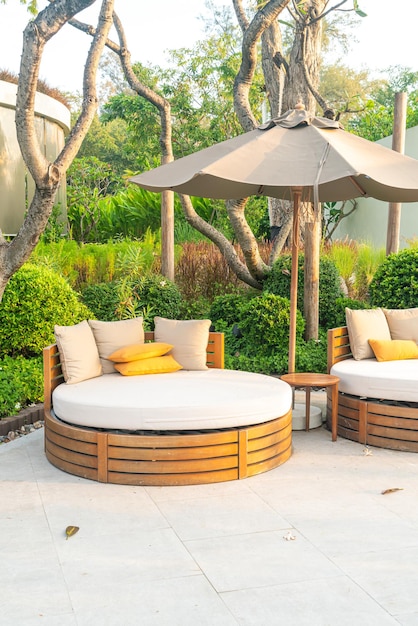 Pillows on outdoor patio chair with umbrella