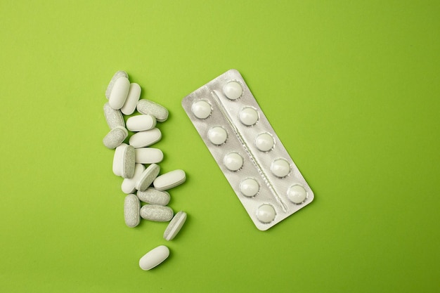 Pills on a green background