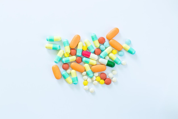 pills on a white backgroundStack of different pills isolated on white background