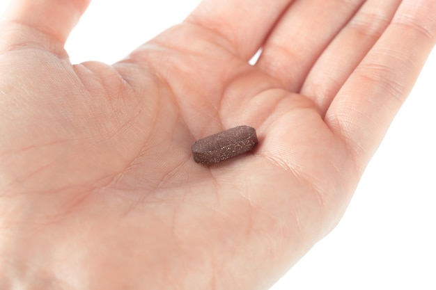 Pills in woman hand