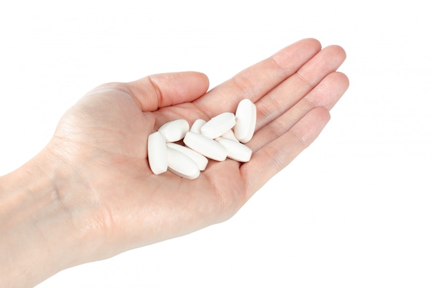 Pills in woman hand