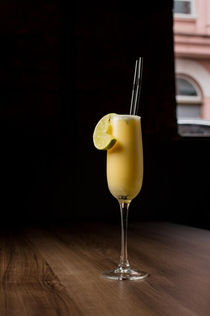 Pina Colada cocktail on a dark background Pina Colada cocktail on wooden bar counter