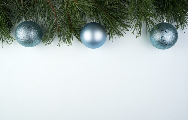 Pine branches frame with silver Christmas balls