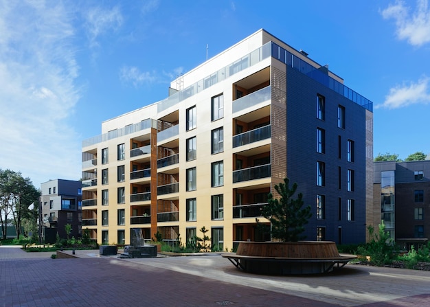 Pine tree at architectural complex of residential buildings. And outdoor facilities.