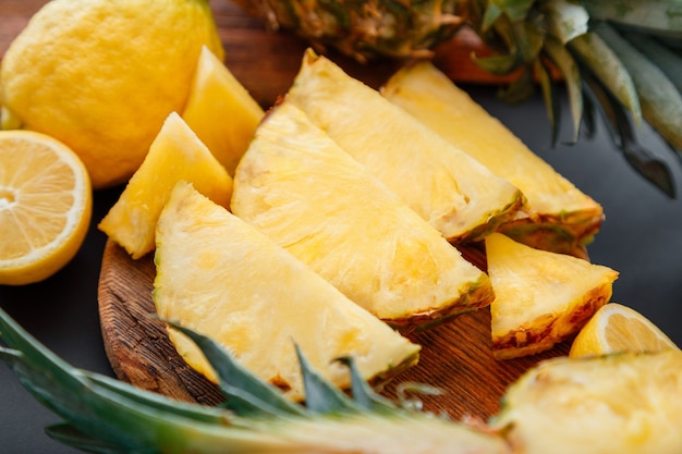 Pineapple on cutting board. Summer tropical fruit Sliced pineapple slicing cooking process