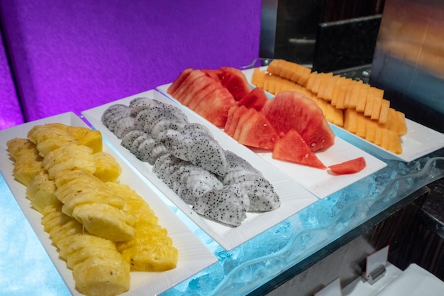 Pineapple Dragon fruit Watermelon Papaya slices preparing for buffet on plate