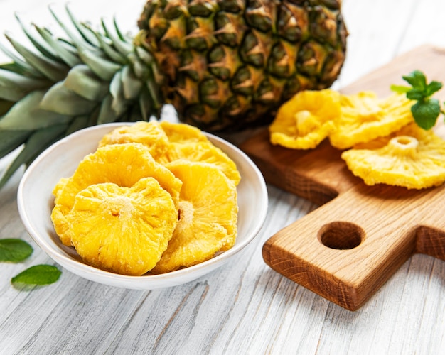 Pineapple dried rings on rustic wooden surface