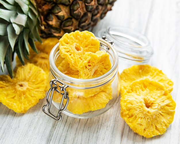 Pineapple dried rings on wooden background