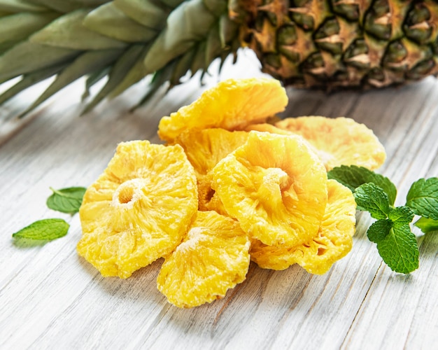 Pineapple dried rings on wooden background