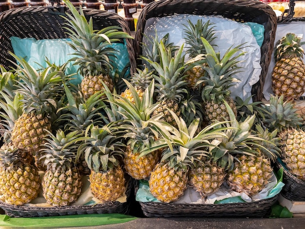 Pineapple fruit in a basket at the supermarket