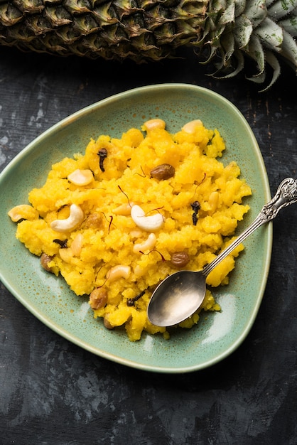 Pineapple sheera or Halwa also known as Ananas keshri shira. Popular South Indian Dessert recipe. selective focus