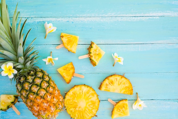 Pineapple slices on wood 