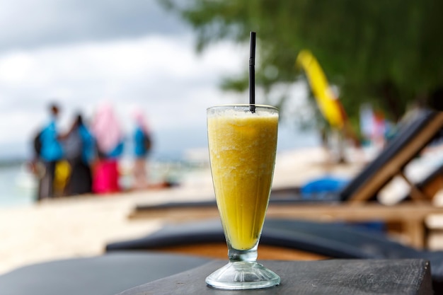 Pineapple smoothie on the beach table