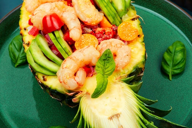 Pineapple stuffed with shrimp rice and avocado