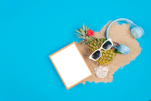 Pineapple in a sunglasses and mockup board on white background