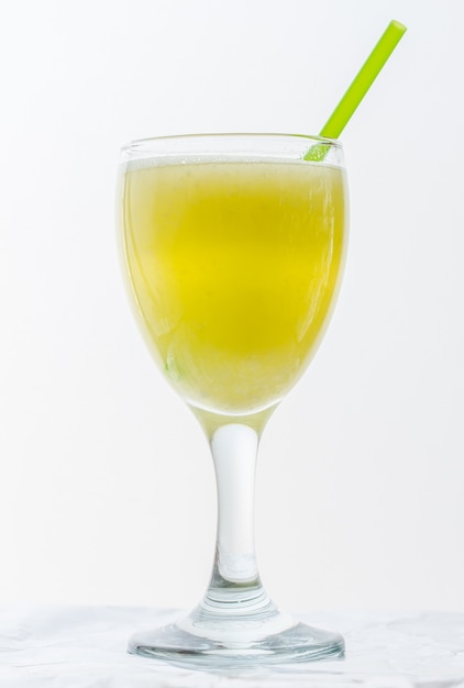 pineapple water in glass on white background