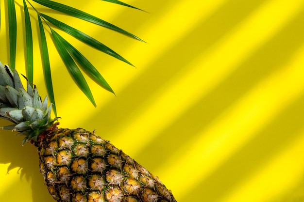 Pineapple with on yellow background