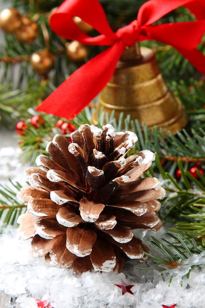 Pinecone with christmas decoration and snow