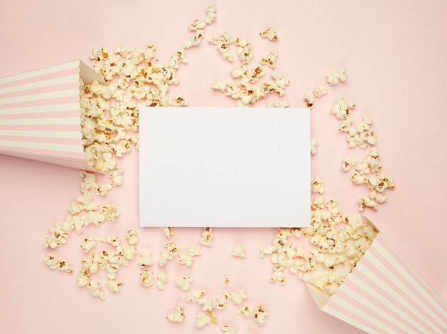 pink background and spilled popcorn