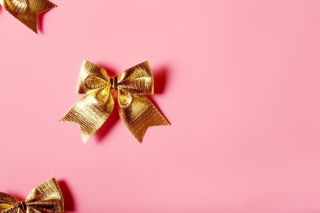 Pink background with golden bows