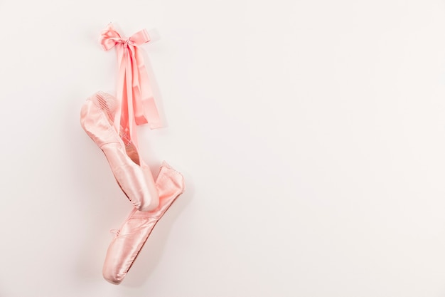 Pink Ballet shoes on white background.