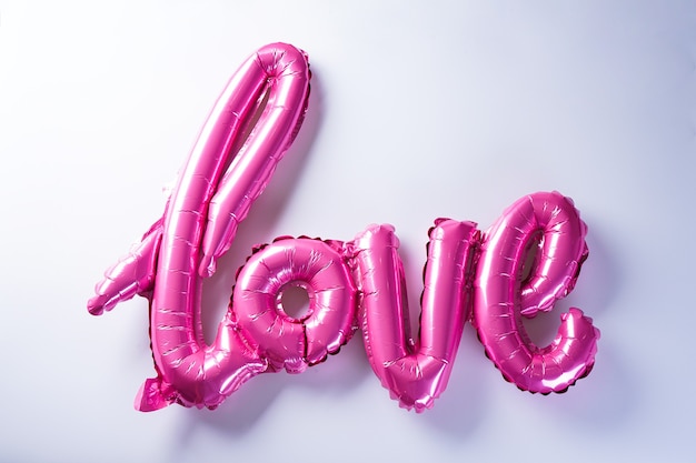 Pink balloons in the shape of the word "Love". Valentine's Day. Love concept. Holiday. pt of romance. Valentine's Day.