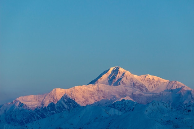 Pink-blue Denali Mountain at Sunrise. Alaska, USA