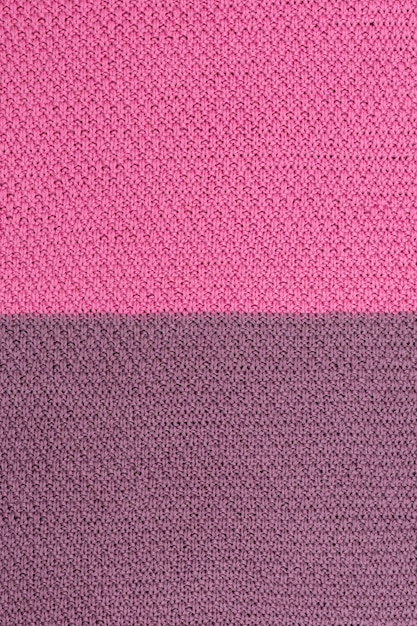 Pink and brown knitted fabric pearl woolen background The structure of the fabric with a natural texture Fabric background Knitted woolen background