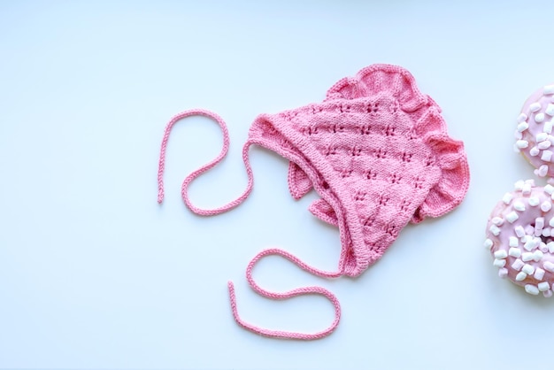 Pink cap for a young child Clothing in the first days of the child's life