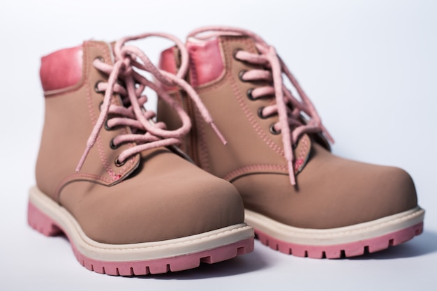 Pink children's female boots over white