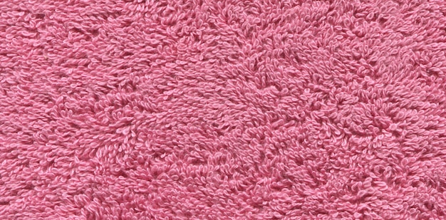 Pink color bath towel texture. Pink cloth bath towel .