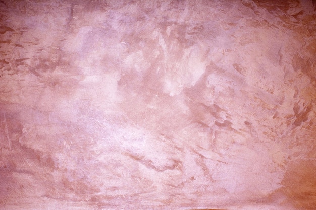 Pink colored abstract textured background Decorative plaster on the wall