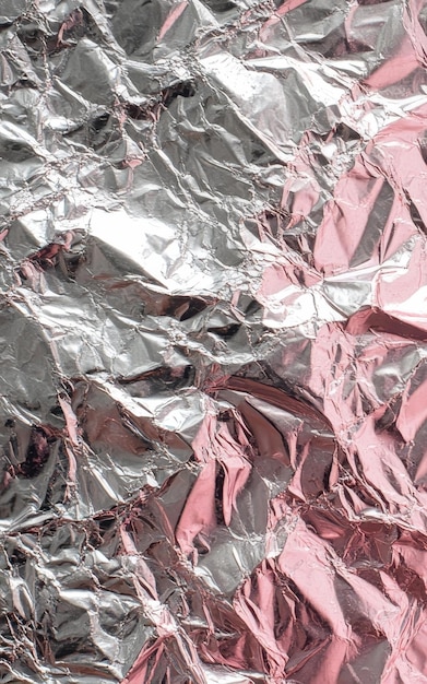 Pink colored crumpled foil texture