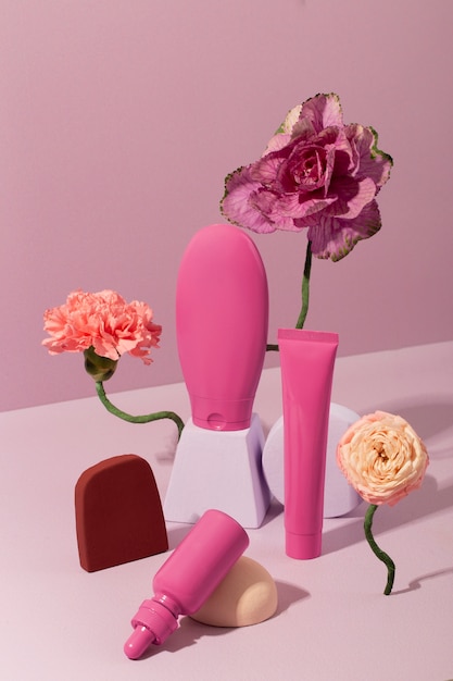 Pink cosmetic products still life