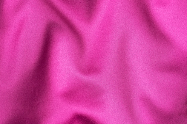 Pink crimson silk texture, table of clothing material.