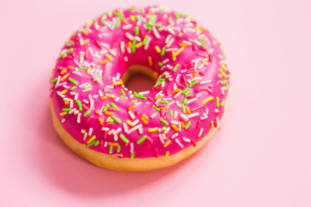 Pink donut on a pink background