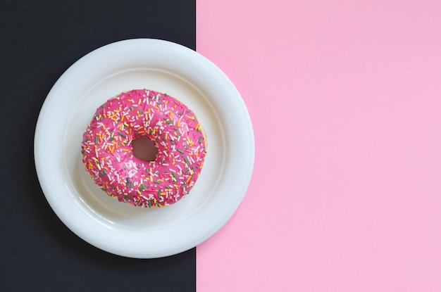 Pink donut in plate