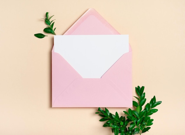 Pink envelope square invitation white greeting card mockup with a boxwood light yellow beige leaves