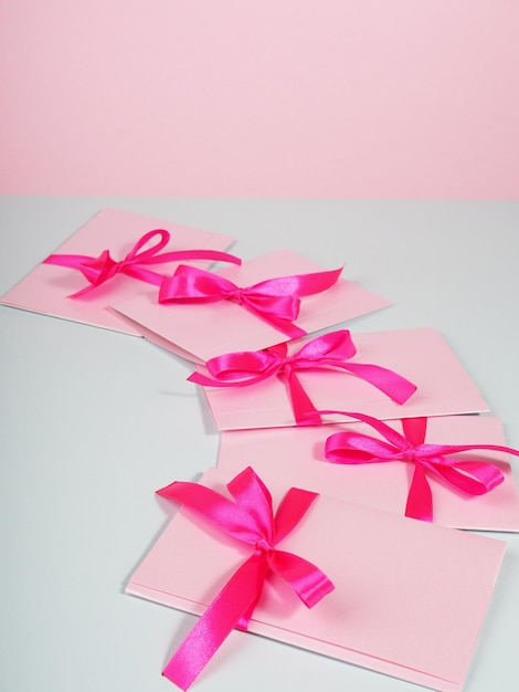 Pink envelope with ribbon, declaration of love, congratulation letter