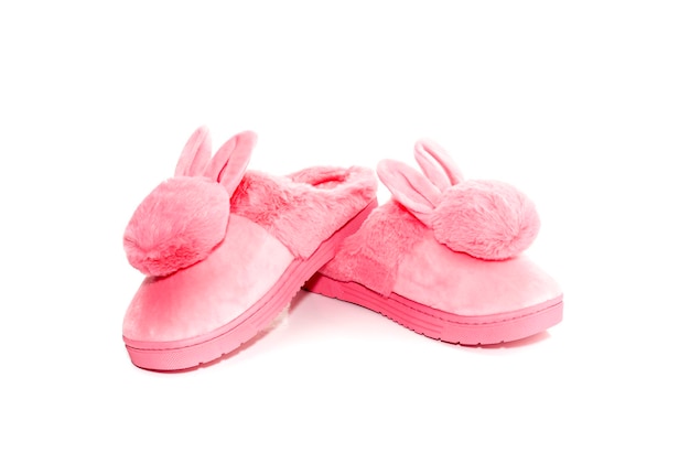 Pink female slippers on a white background