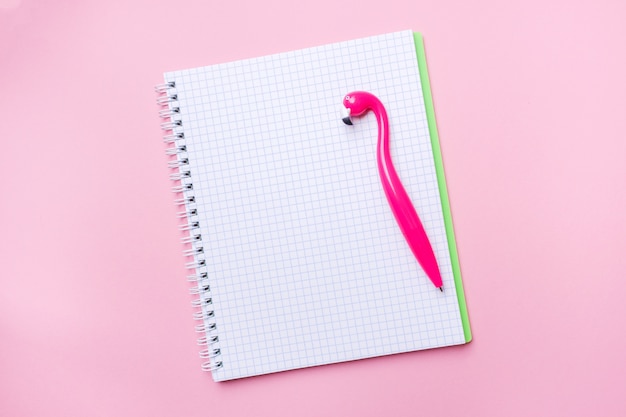 Pink Flamingo pen and writing pad on pink.