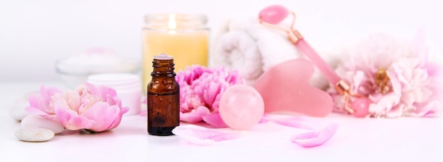 Pink flowers on white background spa facial Selective focus